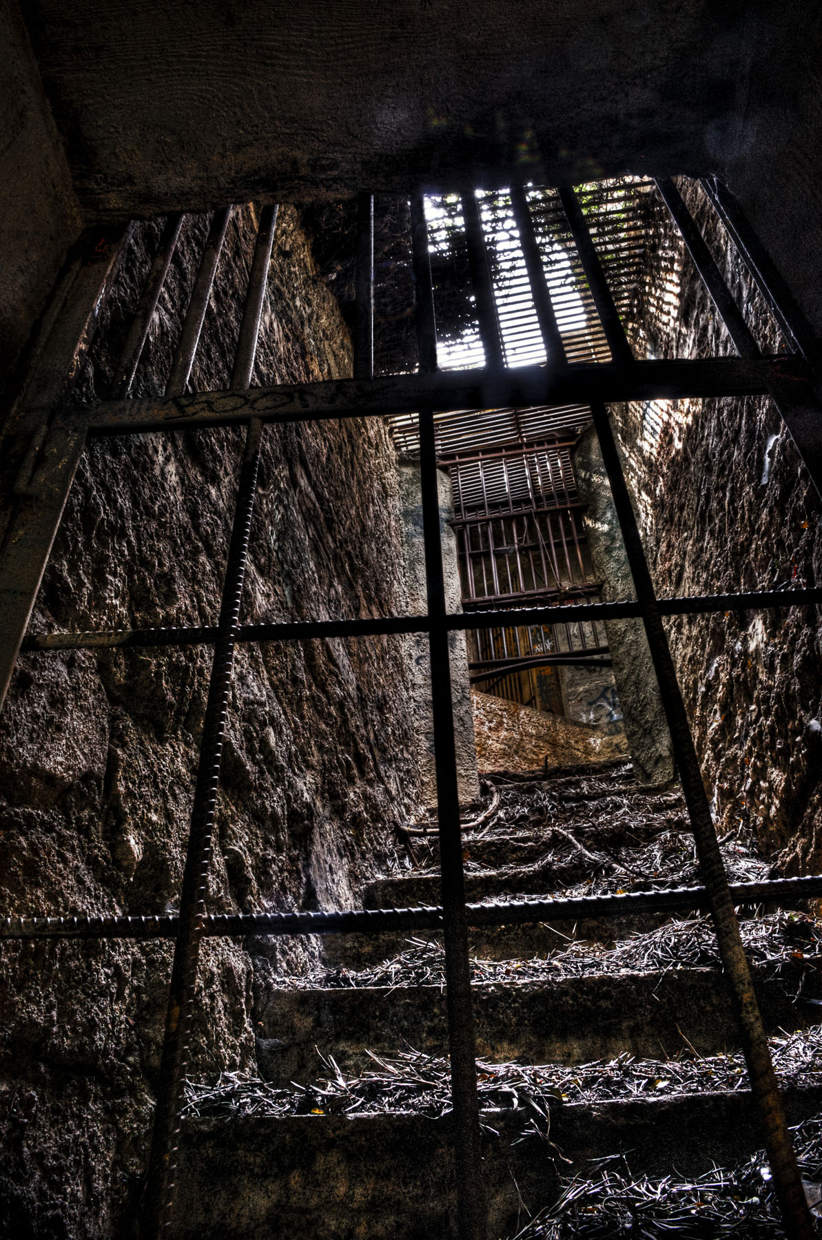 an air vent near a staircase in a dark room