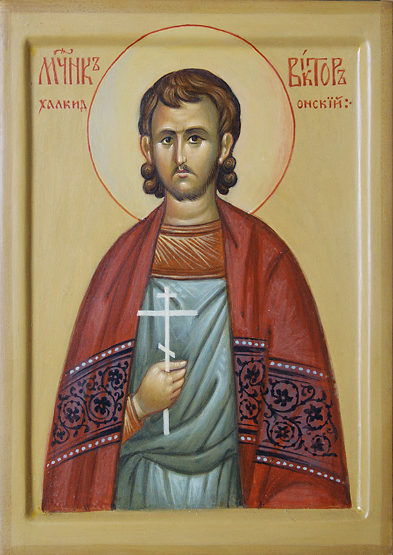 a painted icon of jesus christ with white cross
