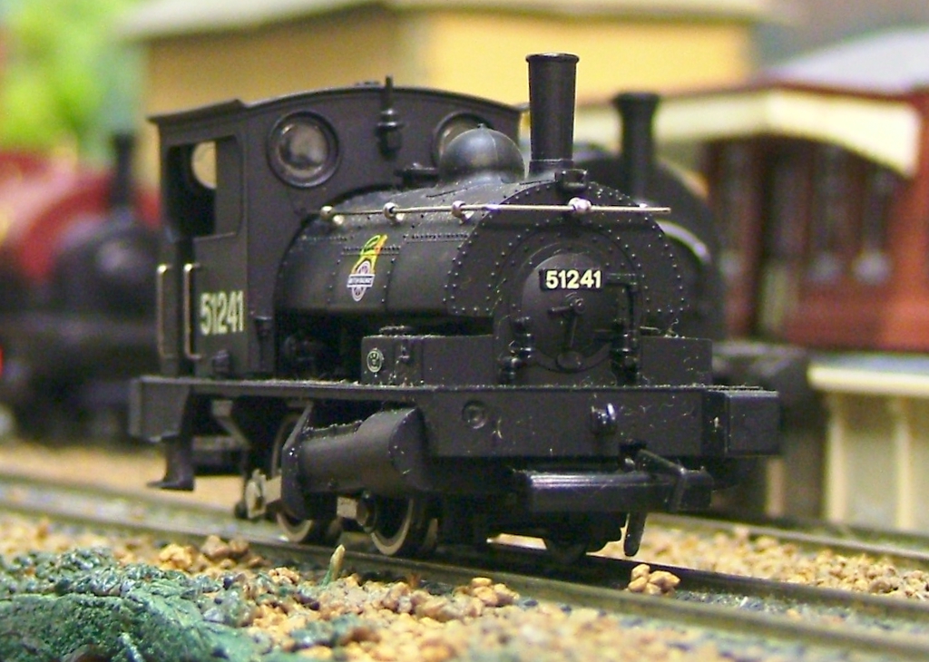 black locomotive train with the number 1843 on it