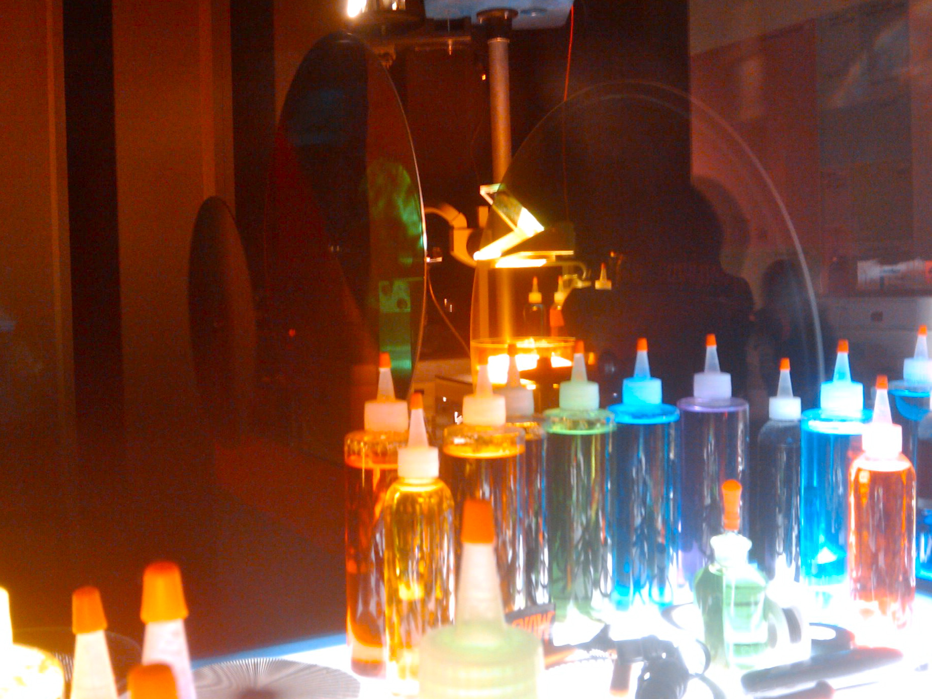 there are many bottles in the window on display