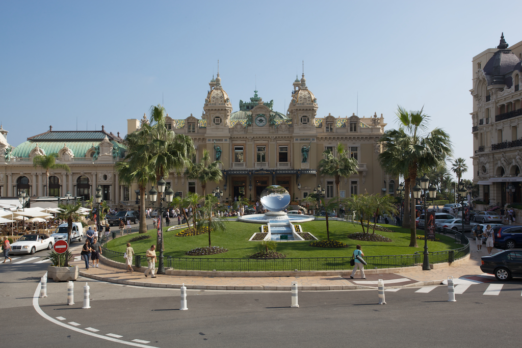 the large building has a huge lawn in front of it