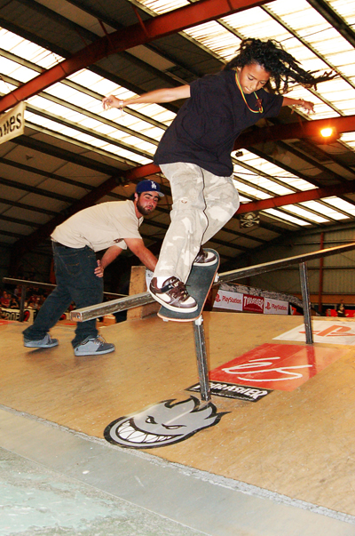 a person on a skate board doing tricks in the air