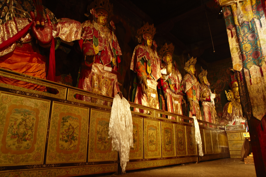 the room has many religious statues displayed in it