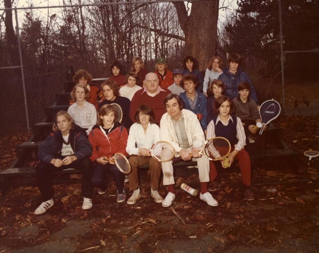 an old po of a tennis court with many people