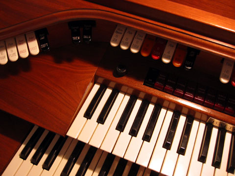 a wooden keyboard has a bunch of keys on it