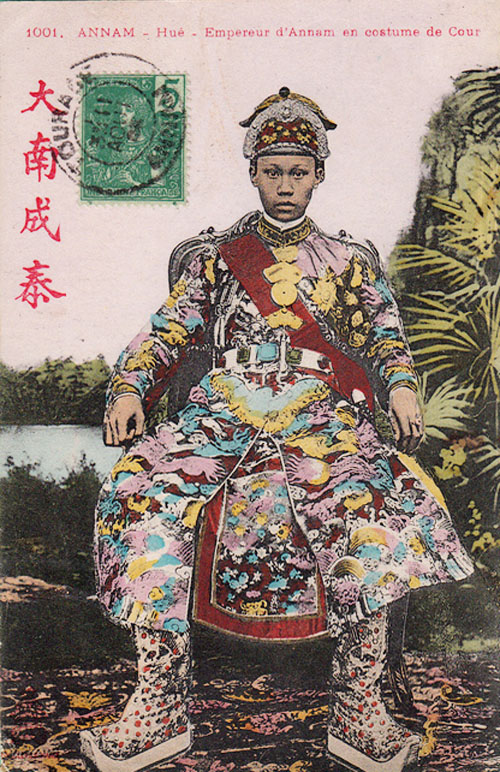an old chinese portrait of a man in a brightly decorated costume