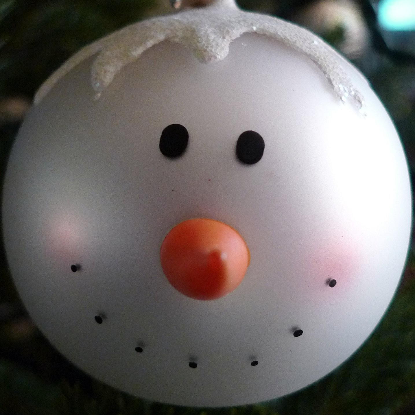 a christmas ornament that is shaped to look like a snowman