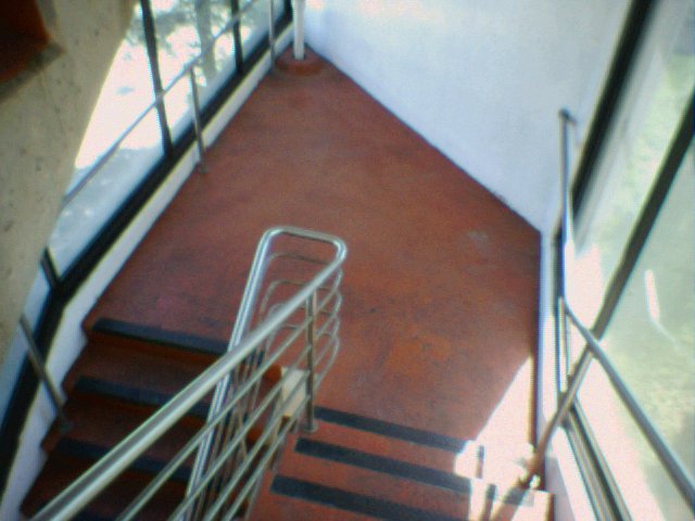 a stairway leading to a door with red steps