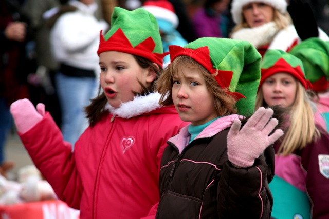 a group of children dressed up in elf outfits
