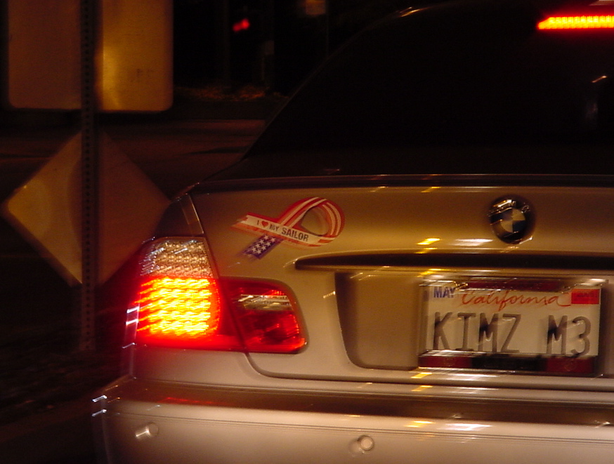 a car with license plates on it, at night