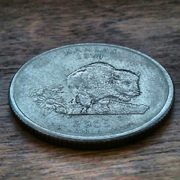 an image of a silver coin sitting on a table