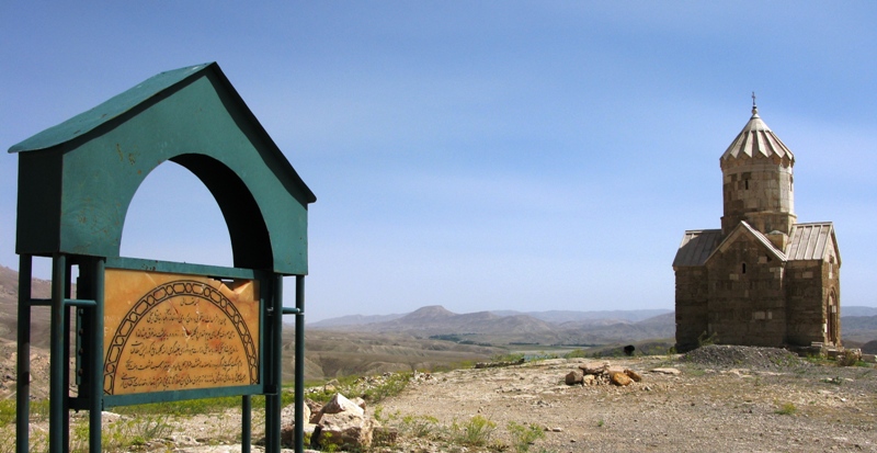 a very old church on a hillside near the desert