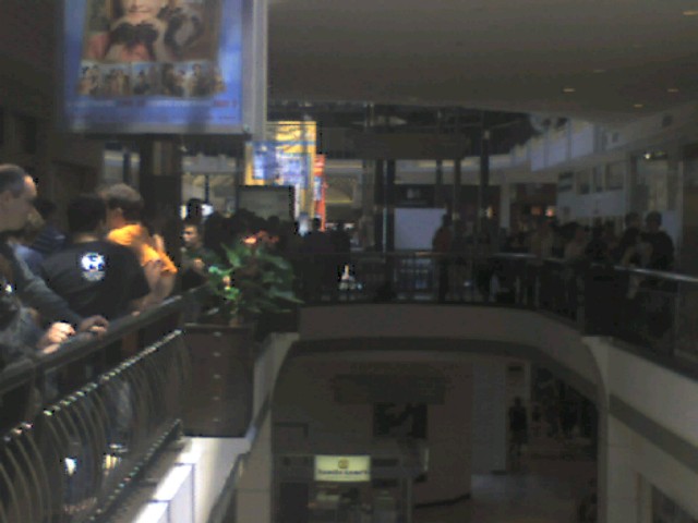 a number of people sitting at a store