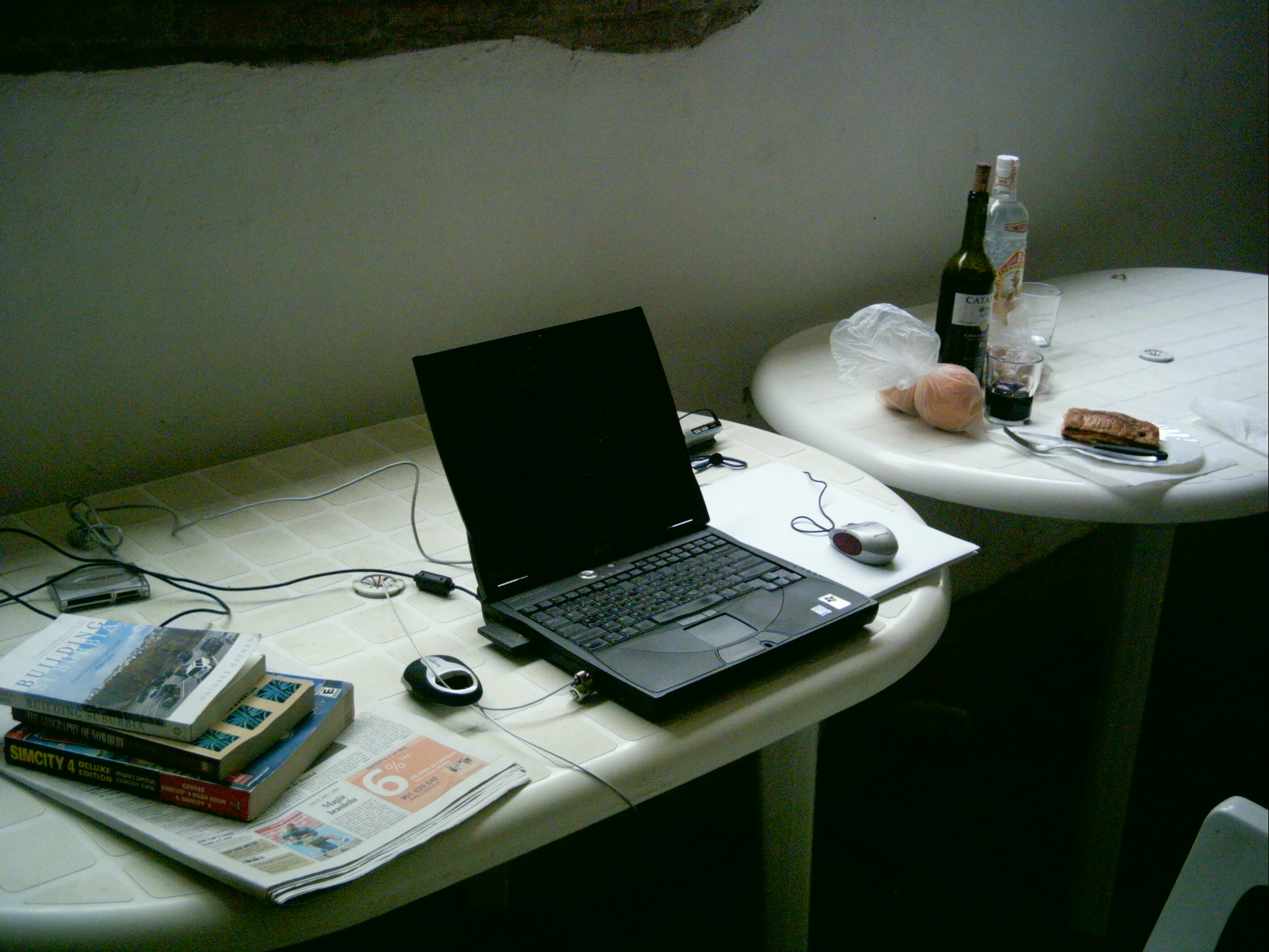 a laptop is sitting on a small table