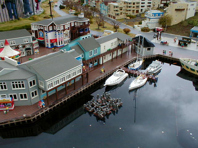 an aerial view of a marina full of boats