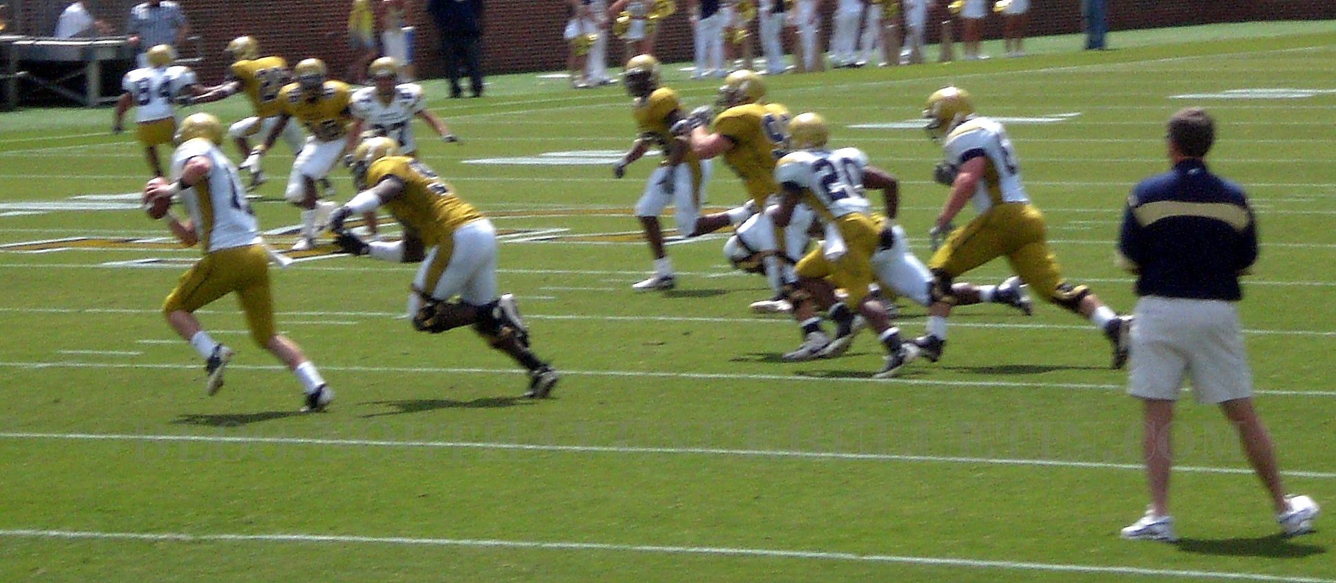 the yellow uniforms are running with the ball