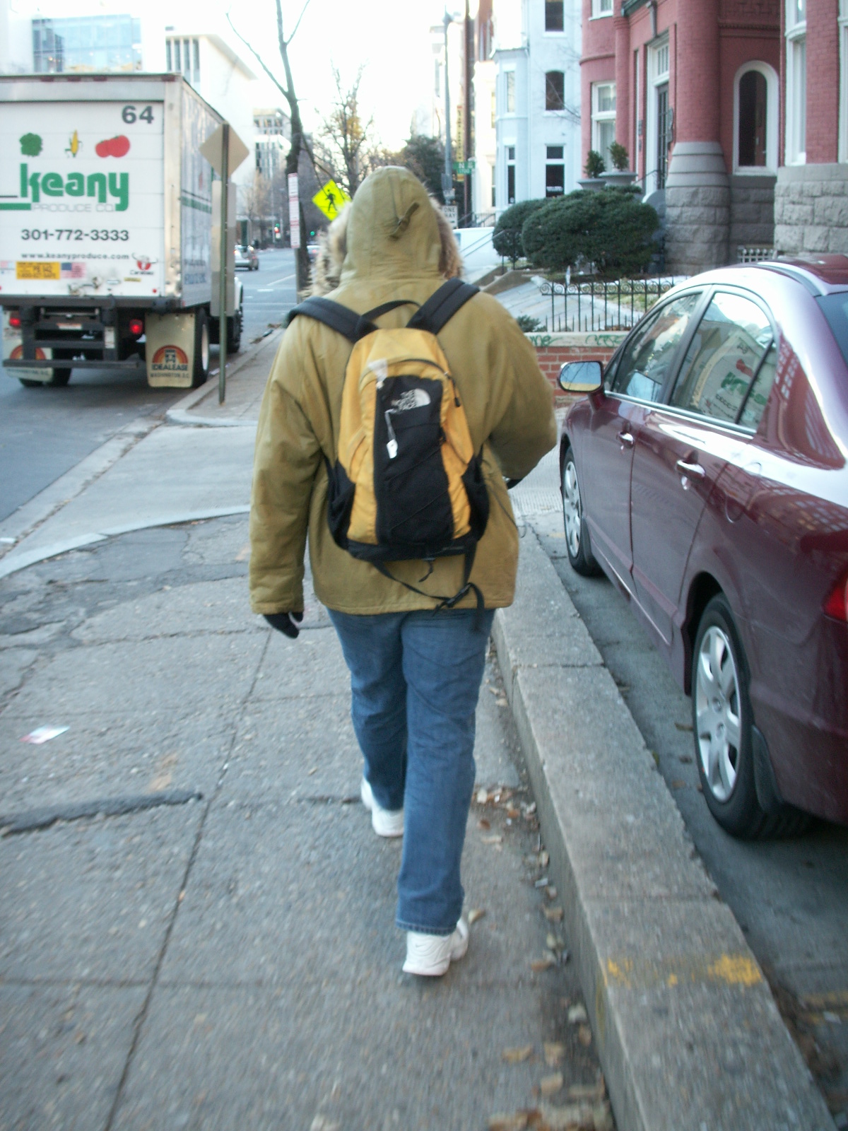 a person walking down the street with a backpack on