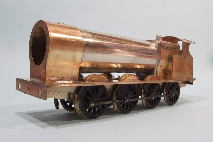 an antique metal and copper model train