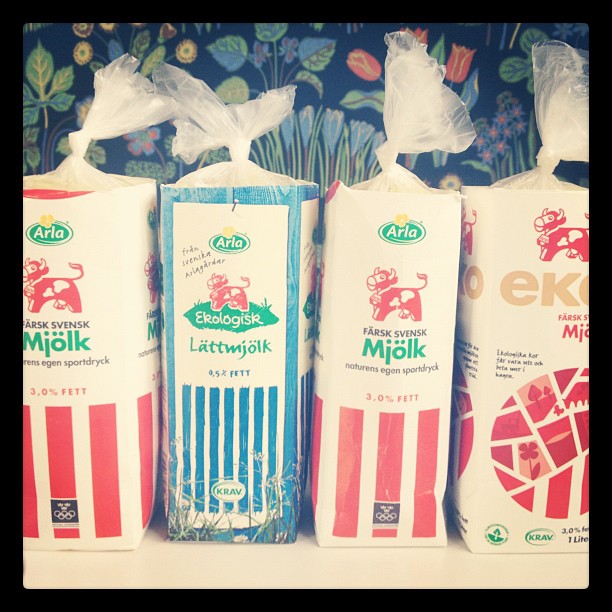 3 boxes with different labels and bags for different types of milks