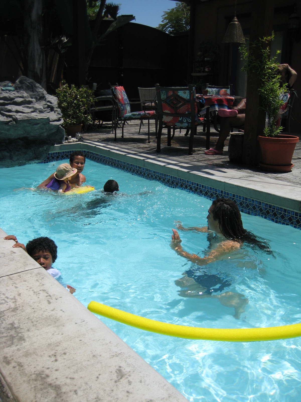 some children are playing in a swimming pool