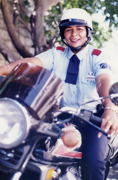 a person in uniform on a motorcycle