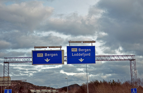 an overcast day with blue signs and a sign that reads bergen and bergen loaded