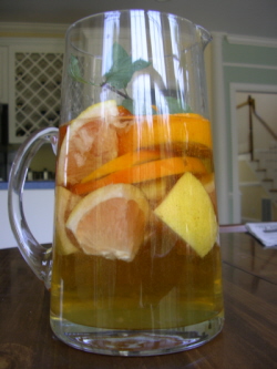 a pitcher of fresh fruit juice on a table