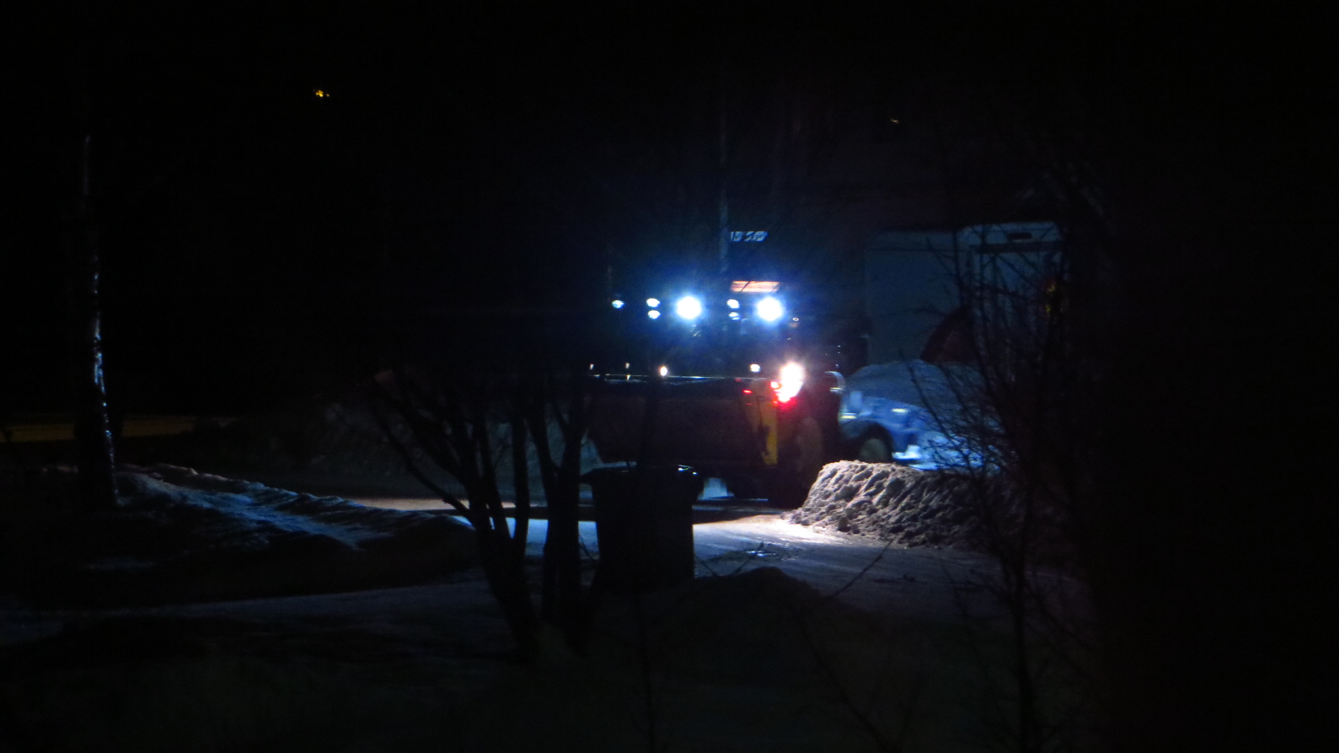 some workers are shining on a night of snow