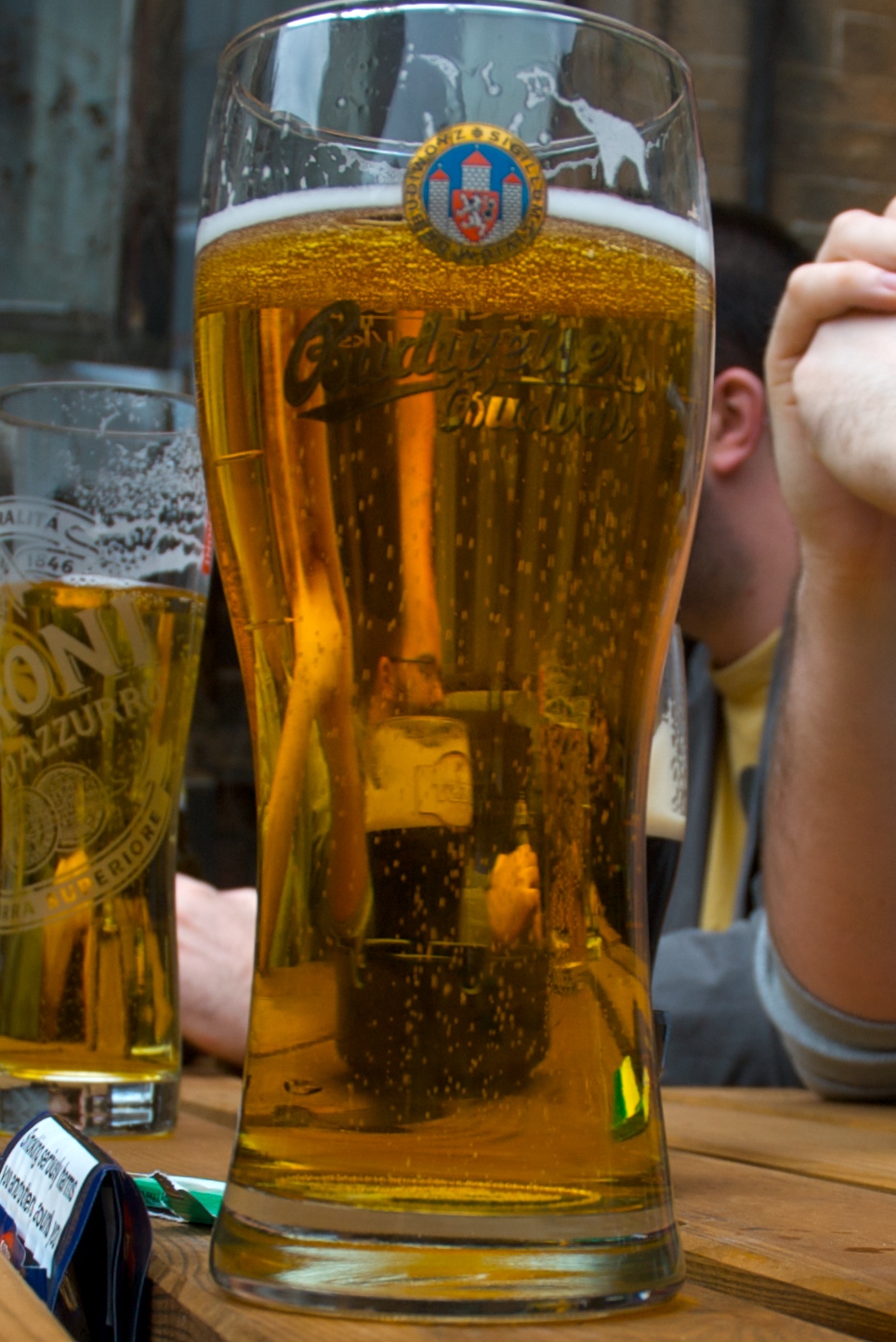 a man is sitting in front of a beer