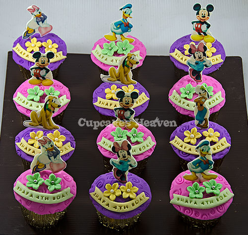 a large number of cupcakes decorated with characters