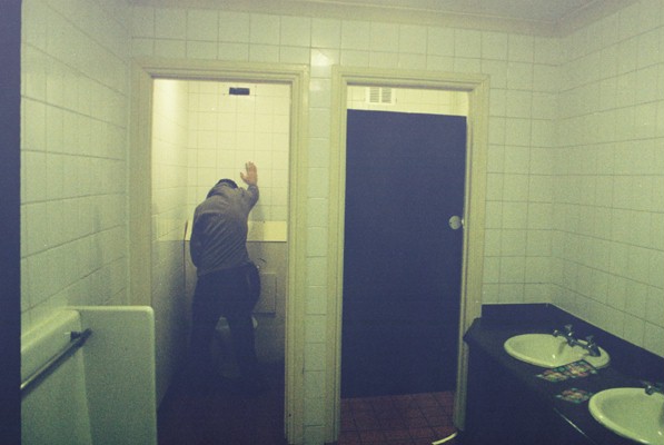 a man taking a selfie in the restroom
