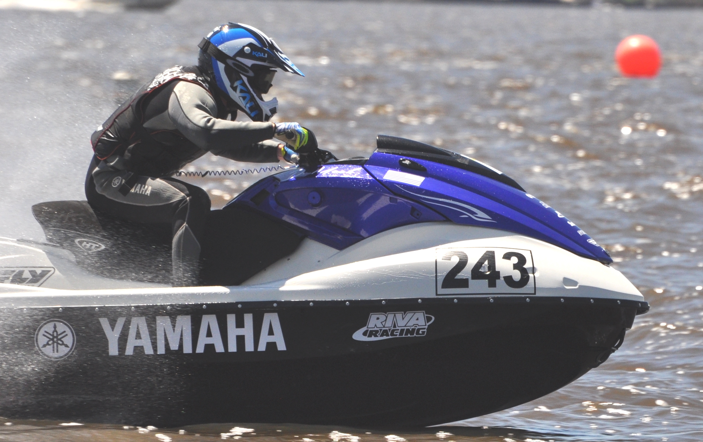 person riding jet ski on large body of water