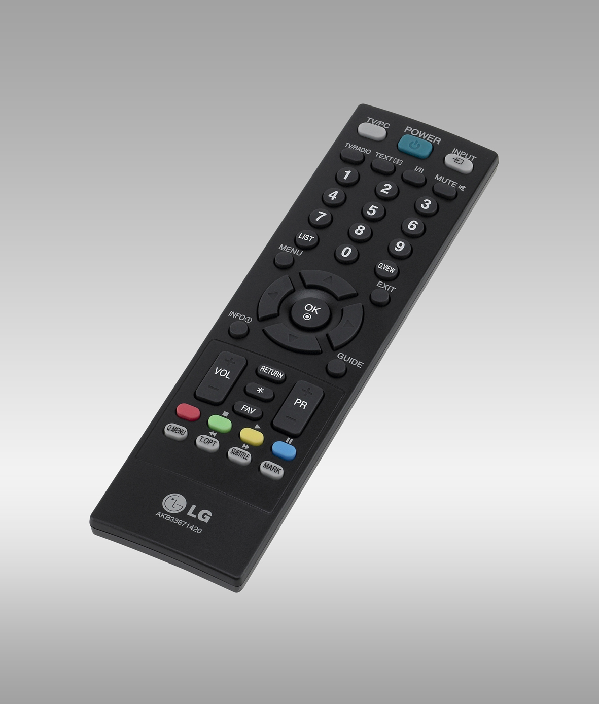 a television remote control on a gray surface
