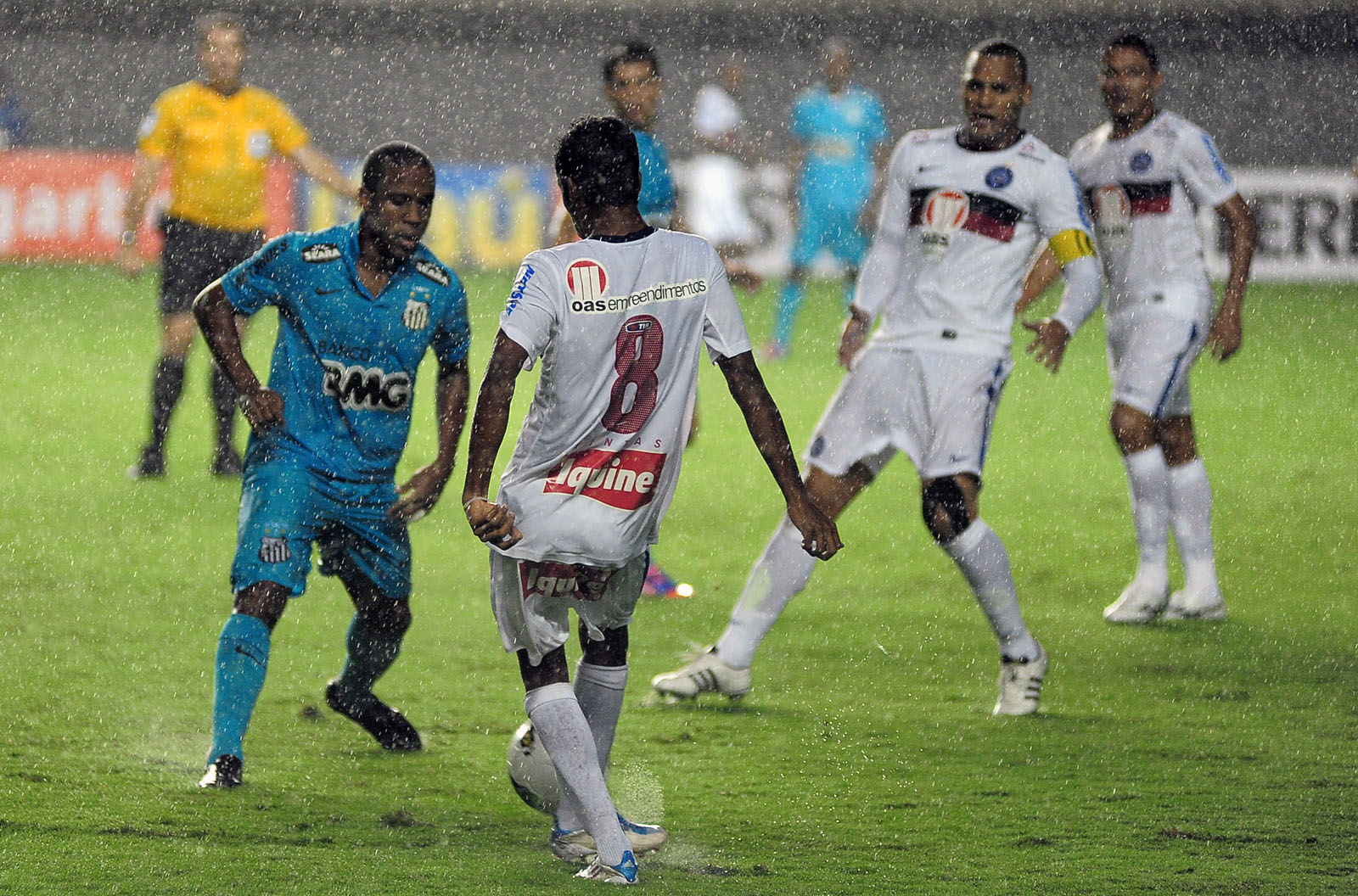 a group of men are playing soccer together