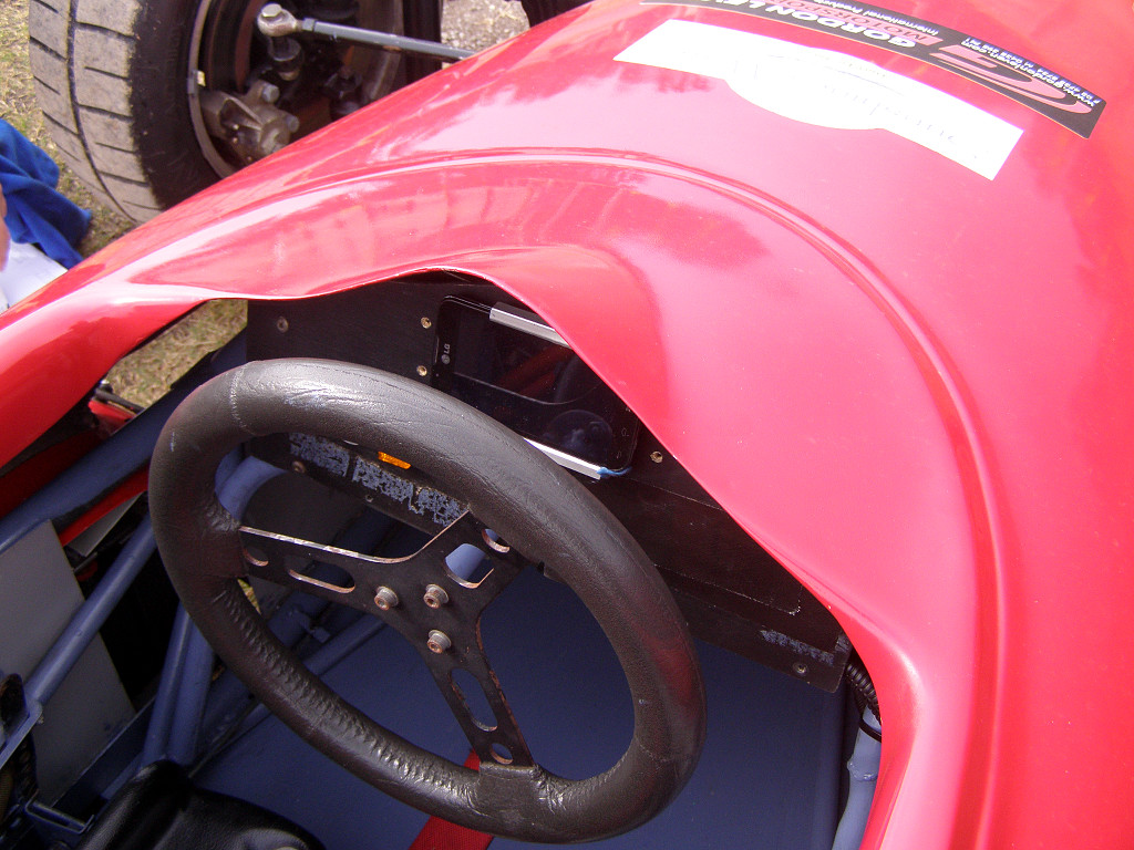 a racing car inside a vehicle with a steering wheel