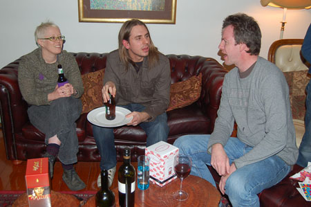 the four people are enjoying a wine tasting