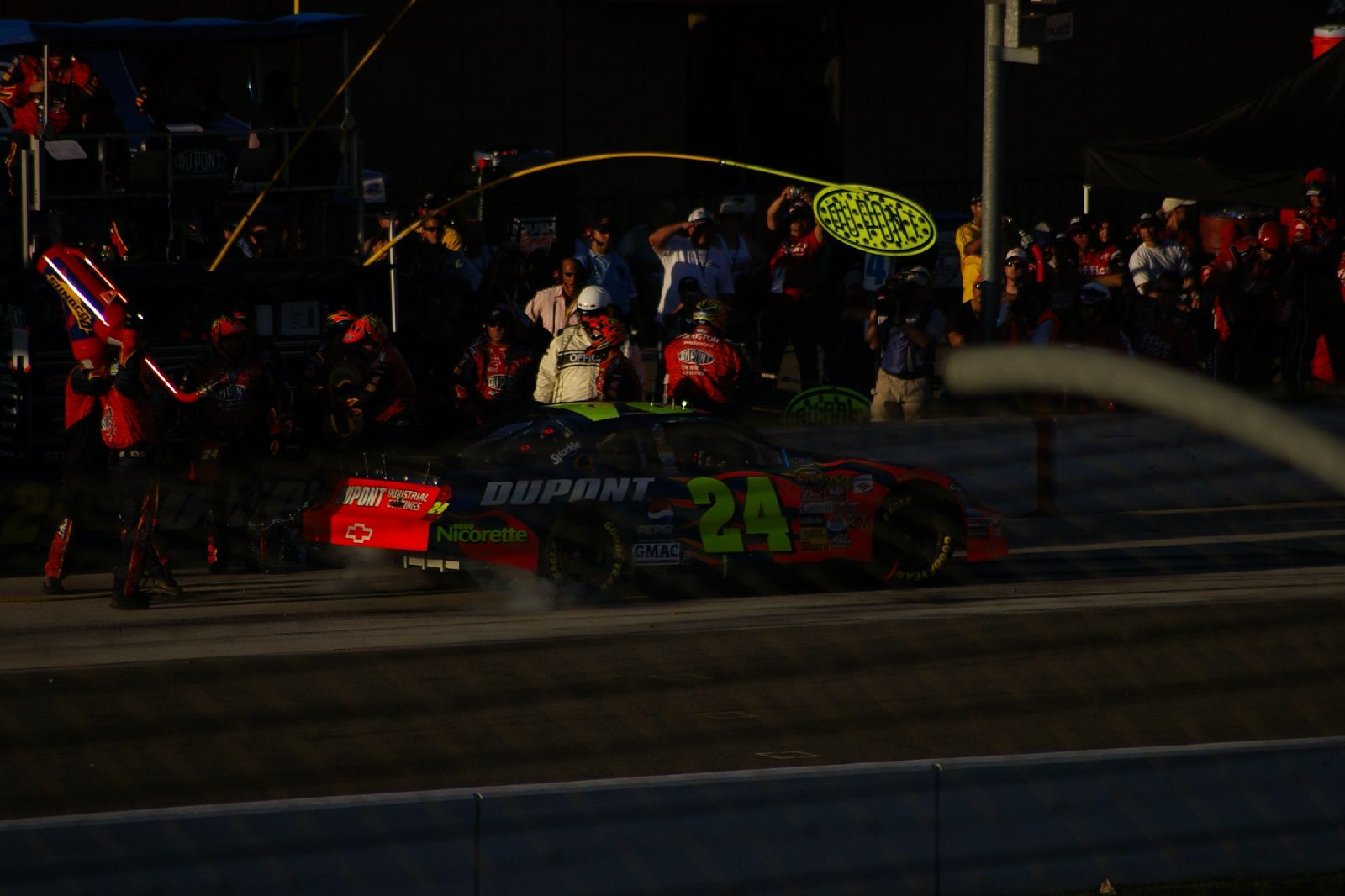 a nascar race car blowing its horn out on the track