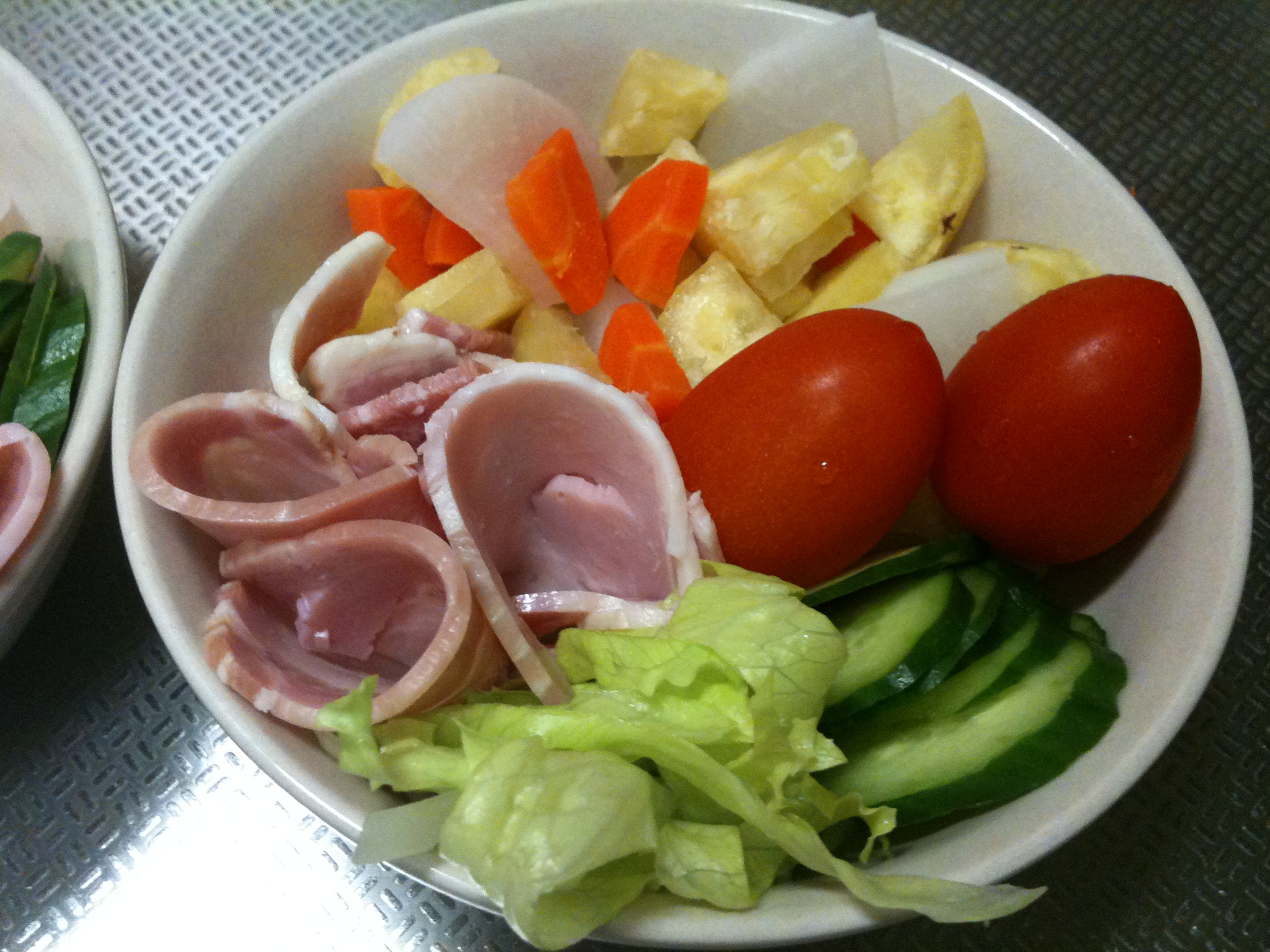 a couple of bowls filled with lots of food