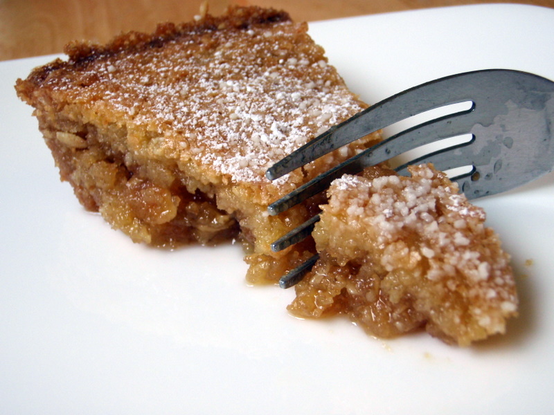 a fork is stuck into a piece of apple pie