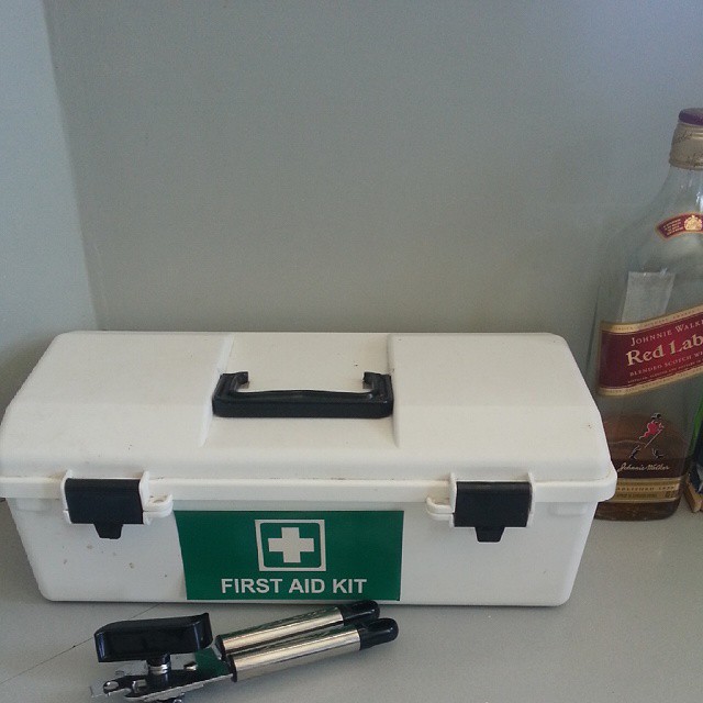 a first aid kit sitting on top of a counter
