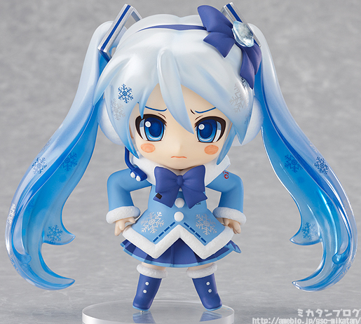 a plastic figure of a cute girl in a blue outfit