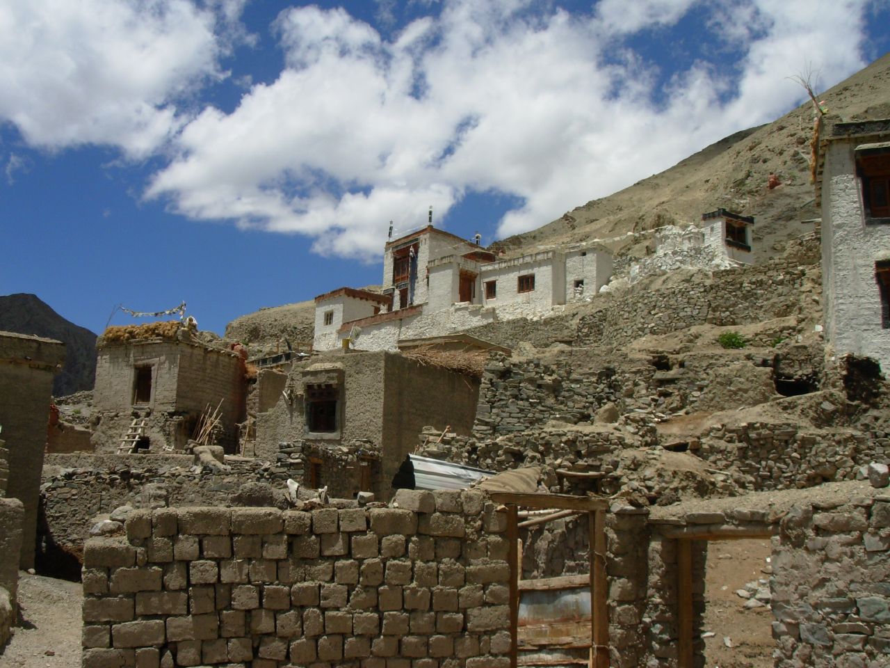 buildings of various heights in an arid area of stone