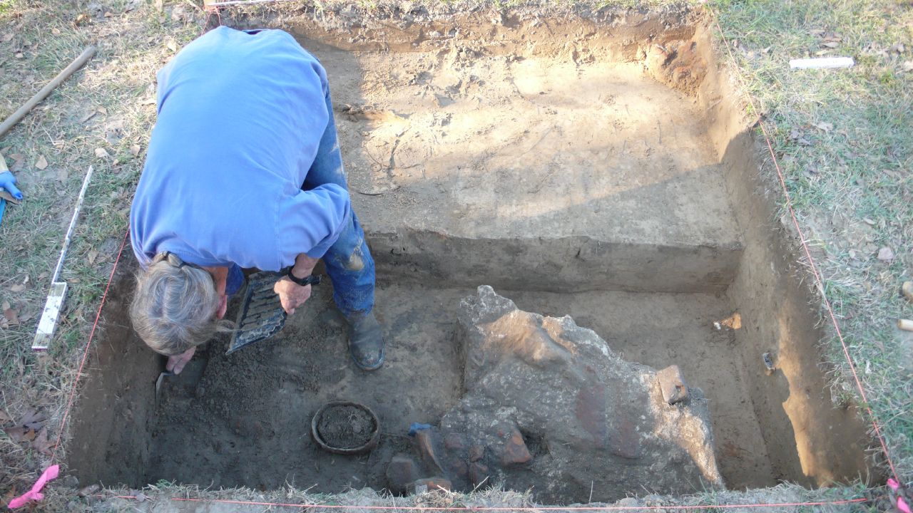 a person working on a well in a field