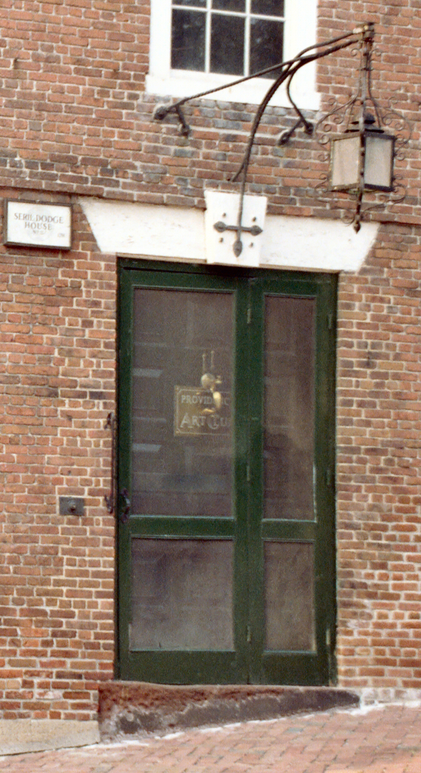 a door in the window of a brick building
