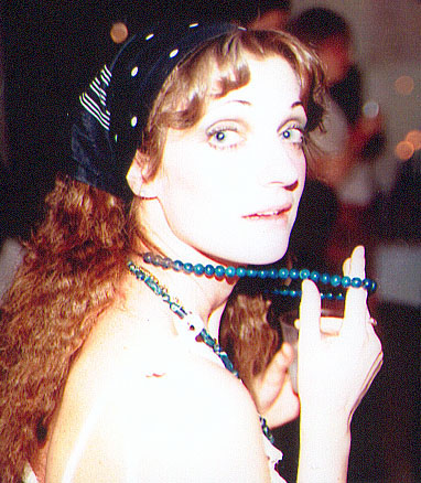 a woman wearing a headband smoking a cigarette