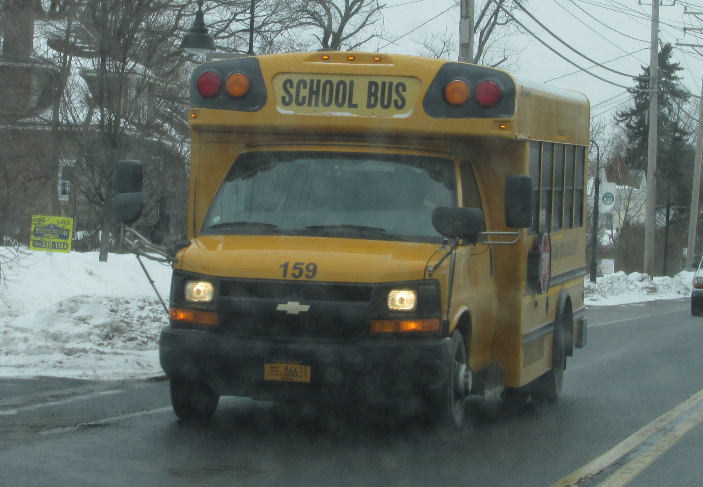 a yellow school bus driving on the road