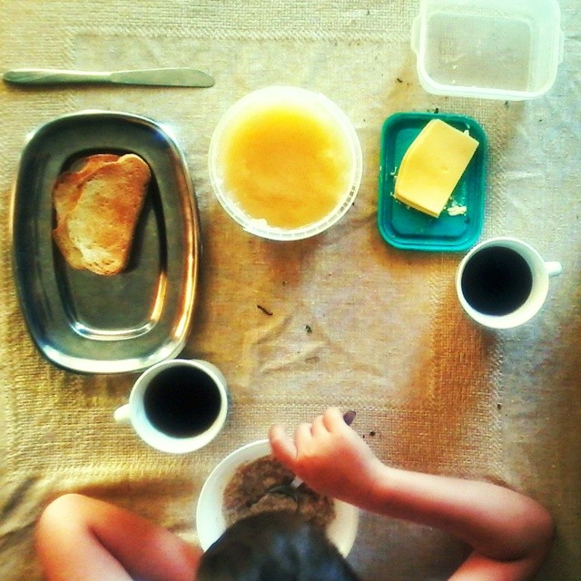 an image of toddler playing with food