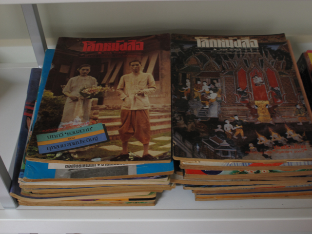 the covers of thai comics are piled up