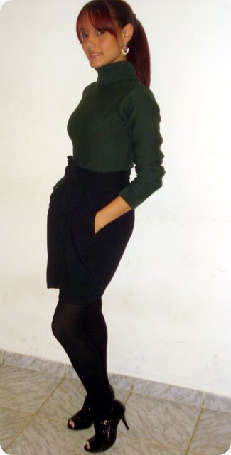 a woman in a tight skirt poses for a po