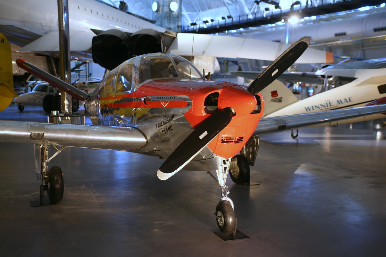 an orange airplane with the number 47 painted on it